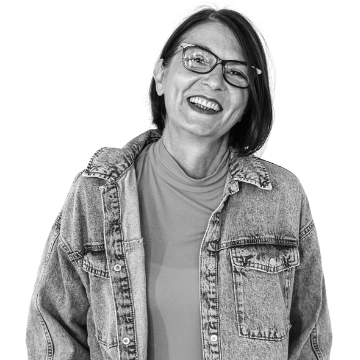 individual with smile wearing glasses