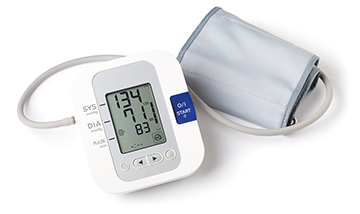 A blood pressure cuff reads out a blood pressure measurement