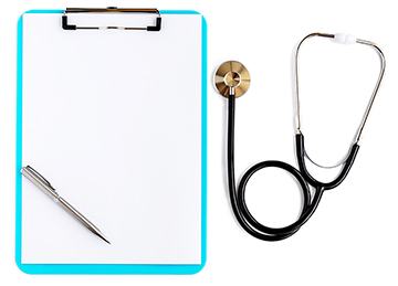 A blue clipboard sits next to a stethoscope