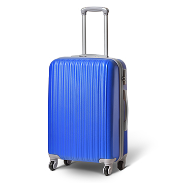 A blue suitcase with handle up