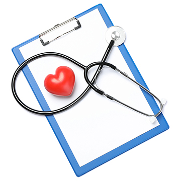 A red heart and stethoscope on top of a clipboard
