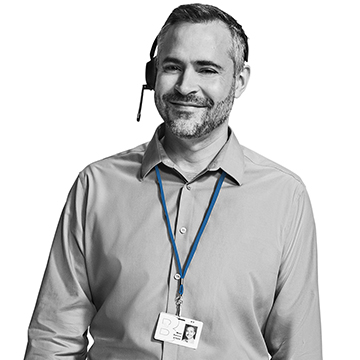 An individual wearing a headset and a badge