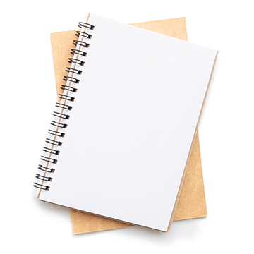 A pad of paper sits atop a folder