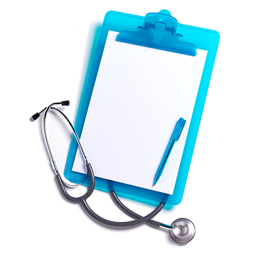 A stethoscope lays over a blue clipboard with blank paper